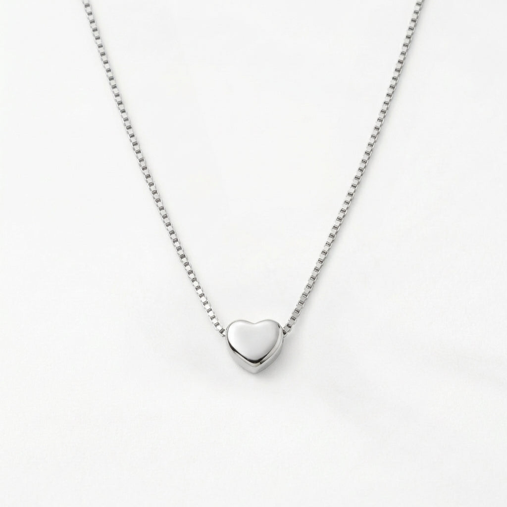 Petite gold heart pendant, alternative angle view