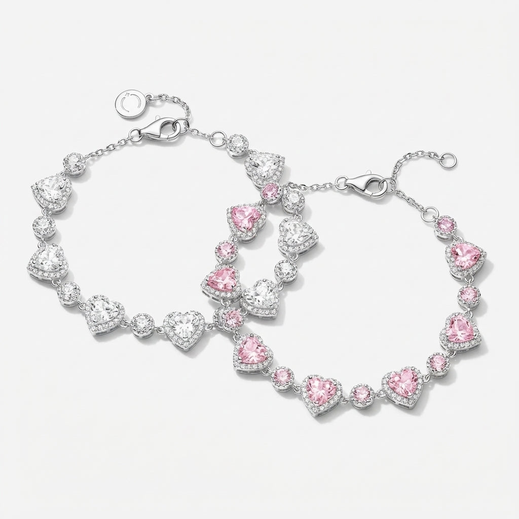 Pink and clear-heart halo bracelets photographed together on a light background