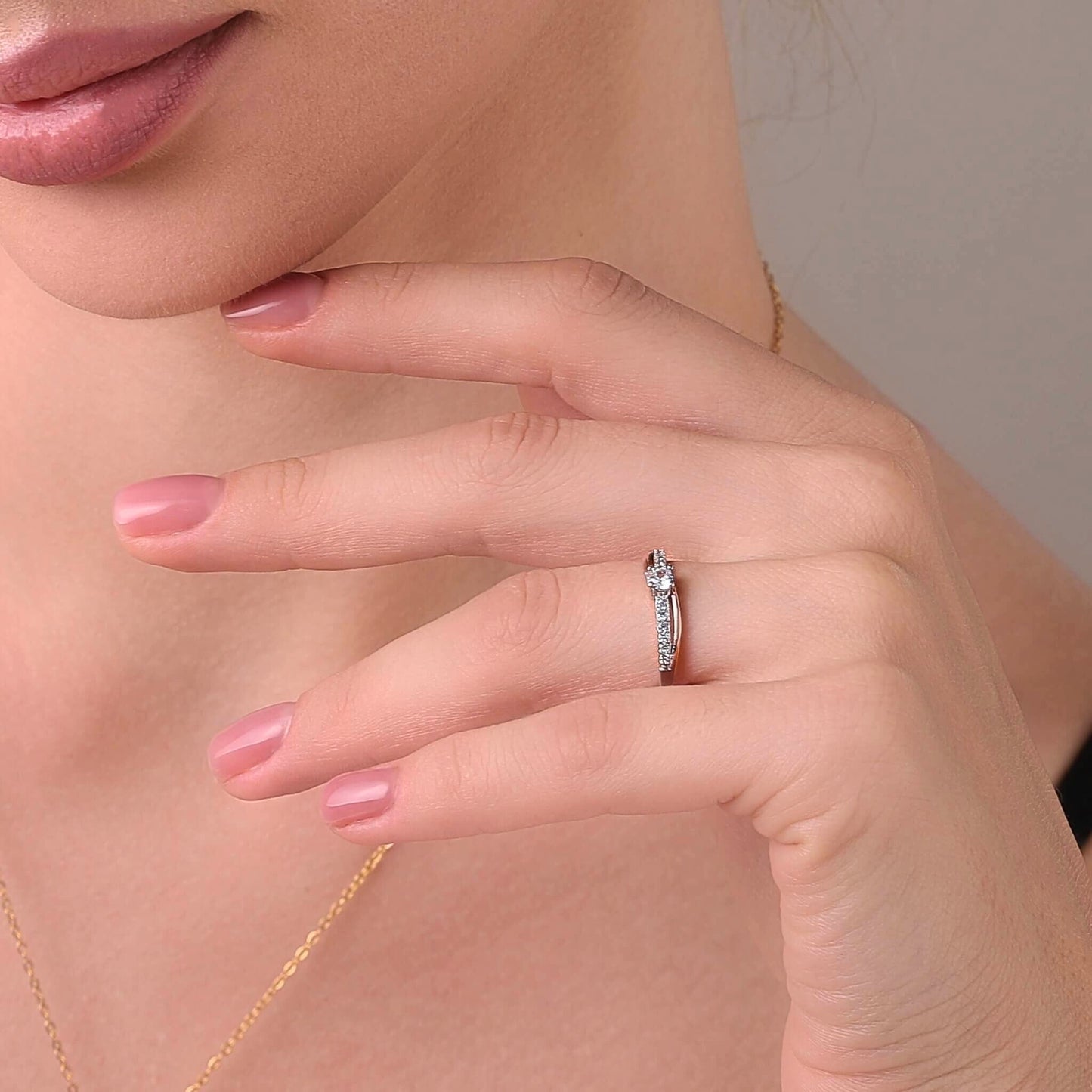 Ups and downs ring styled on a feminine hand