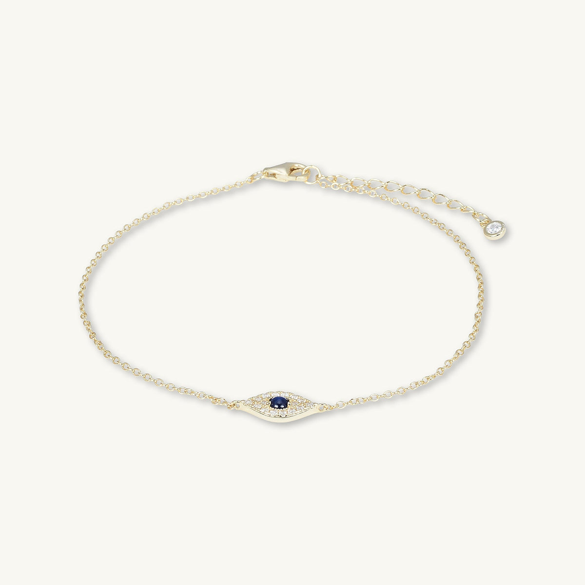 Evil eye chain bracelet on neutral background