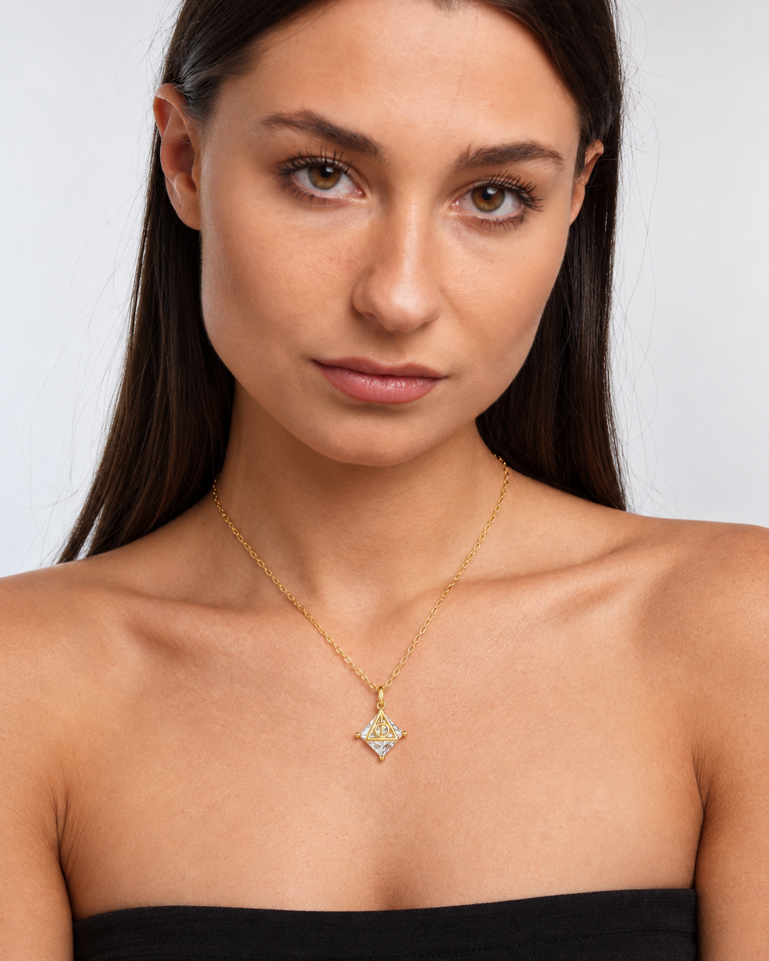 Deathly Hallows Pendant Necklace in gold worn by a model, portrait
