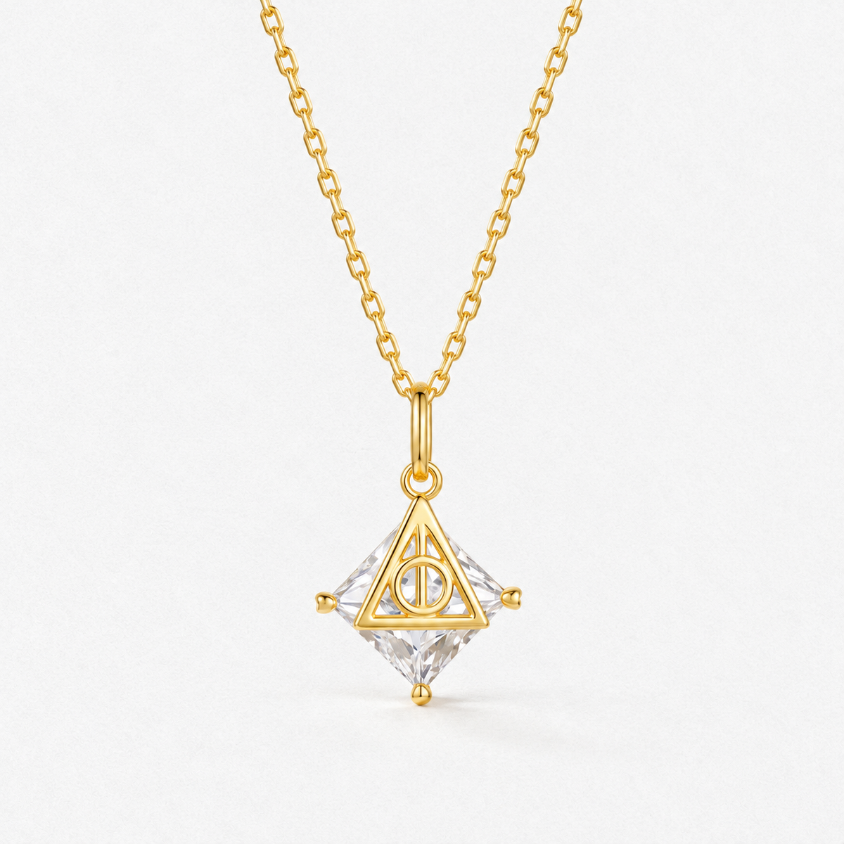 Deathly Hallows Pendant Necklace in gold, product detail on a neutral white background