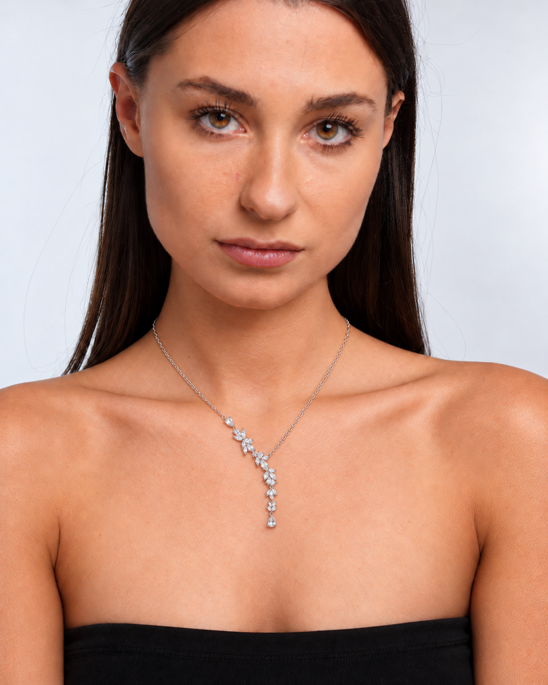 Wisteria silver-coloured floral Y necklace worn on the neckline in front view
