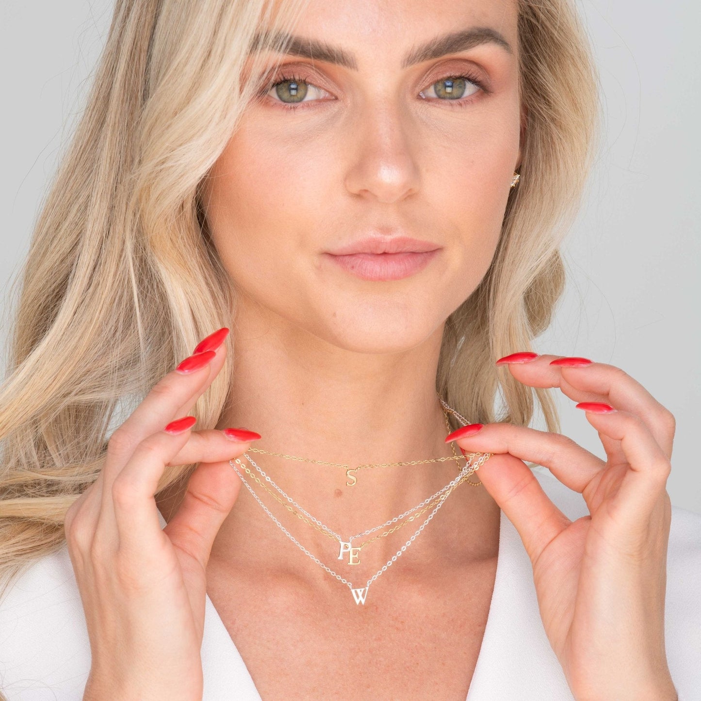 Cursive initial necklace shown with extender chain