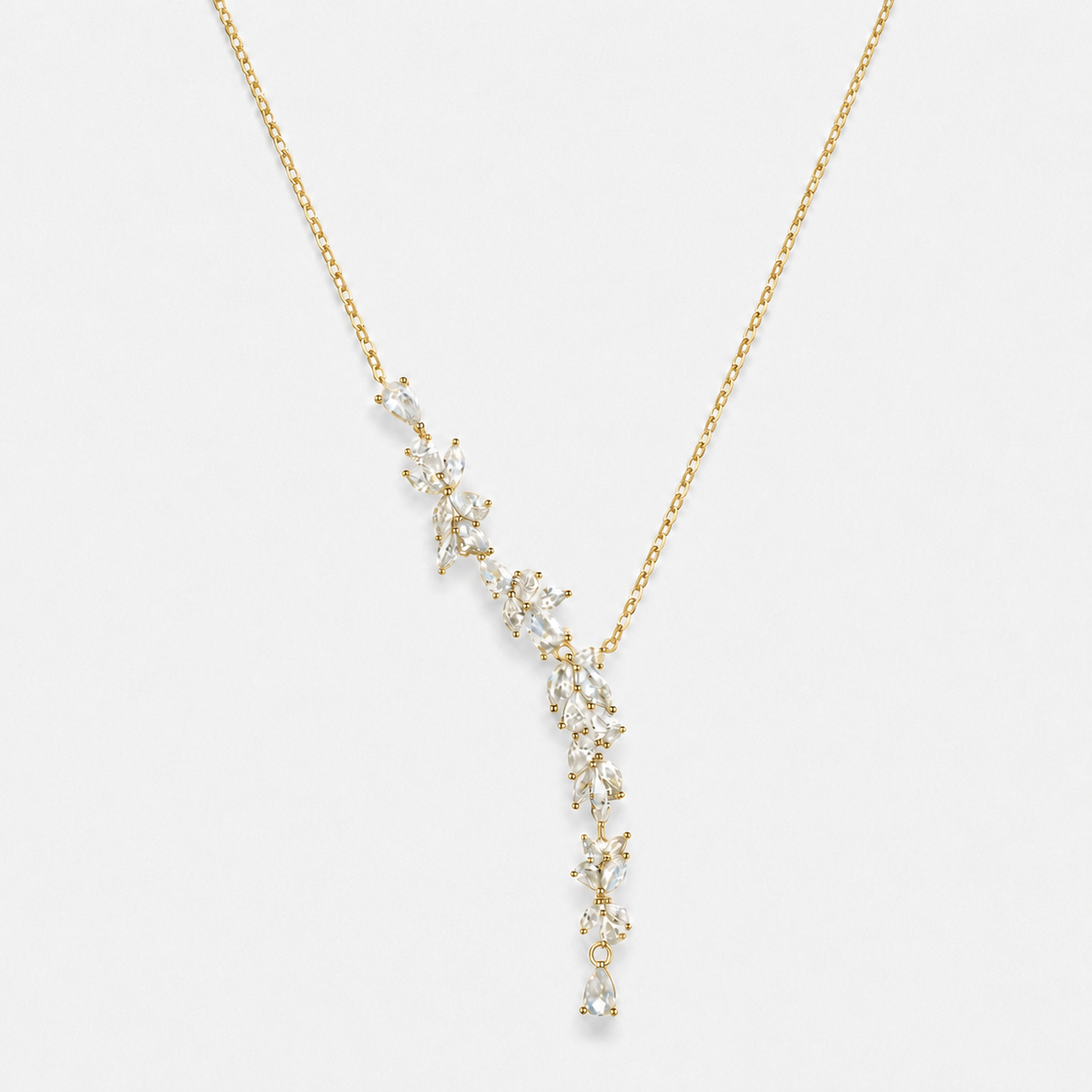 Wisteria floral Y necklace in gold colour with clear stone accents photographed alone
