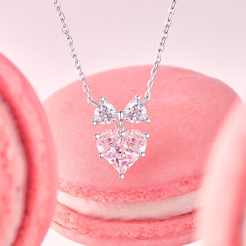 Bow and heart sterling silver necklace, side angle view