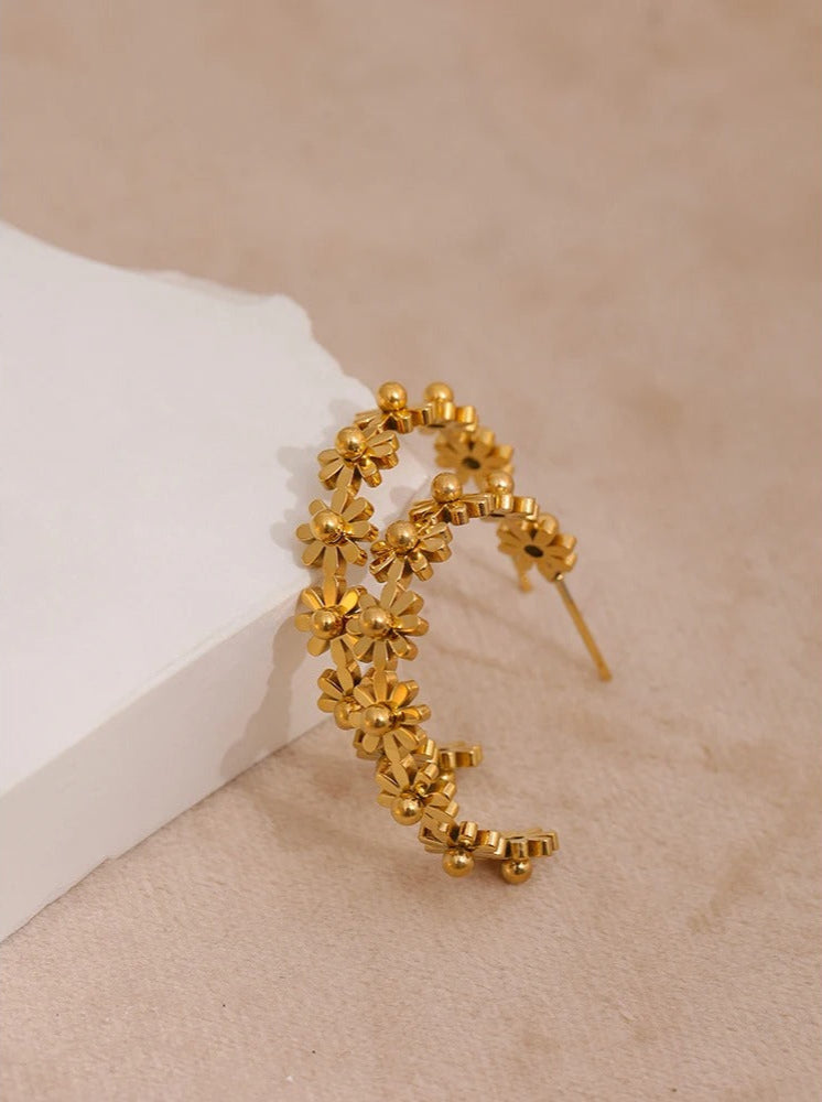 Romantic gold floral hoops, feminine jewellery detail