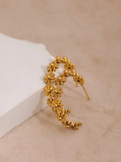 Romantic gold floral hoops, feminine jewellery detail