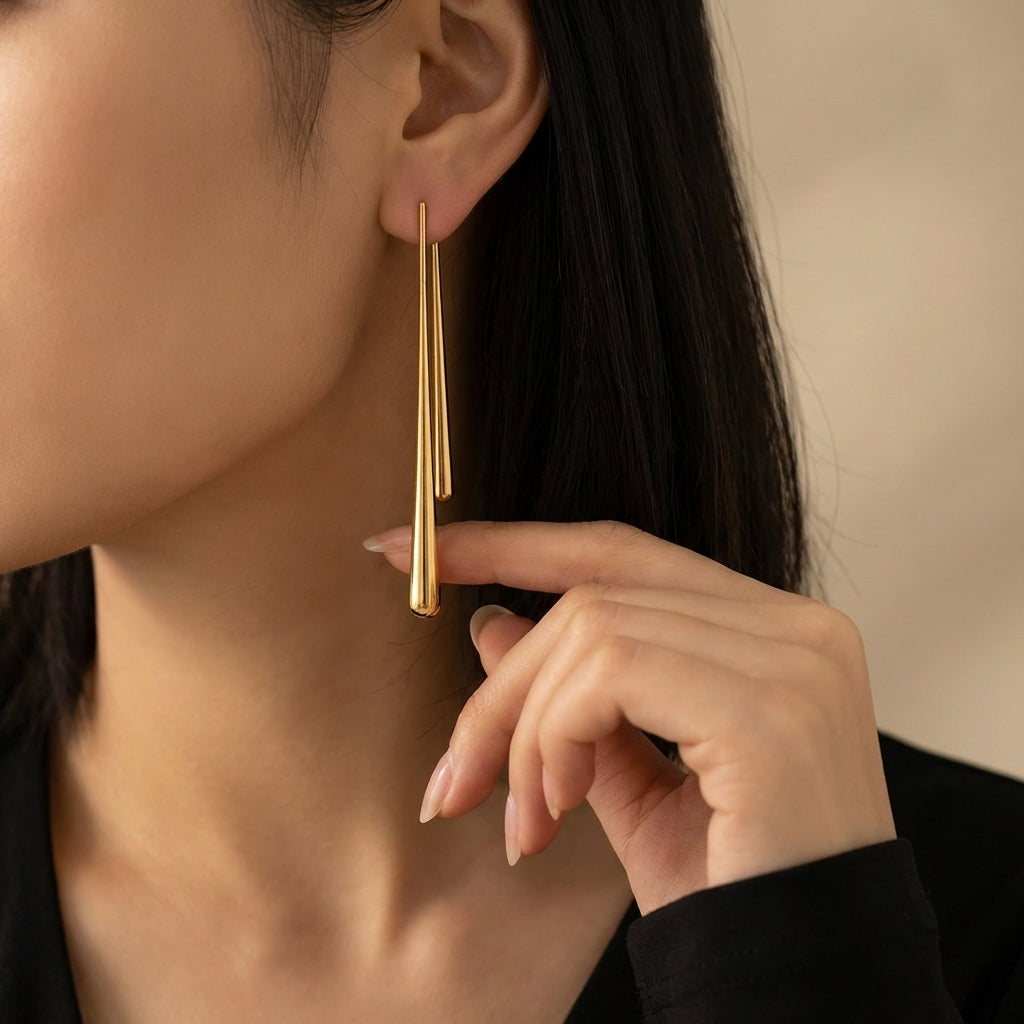 Mismatched water drop earrings – close-up detail