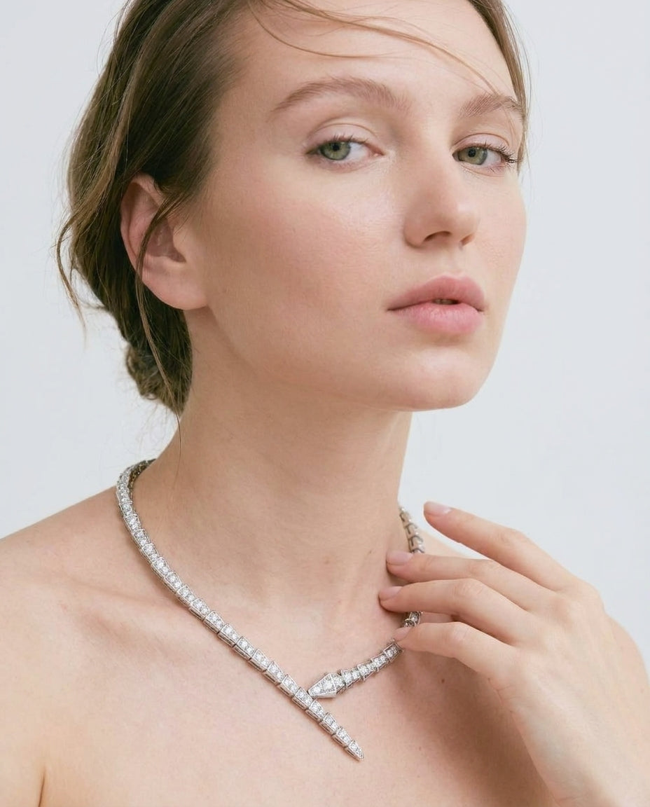 Statement gold snake necklace with cluster of crystals at head
