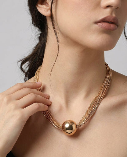 Multi-chain gold necklace with delicate ball pendant detail