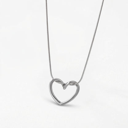 Gold heart pendant necklace detail shot