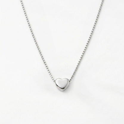 Petite gold heart pendant, alternative angle view