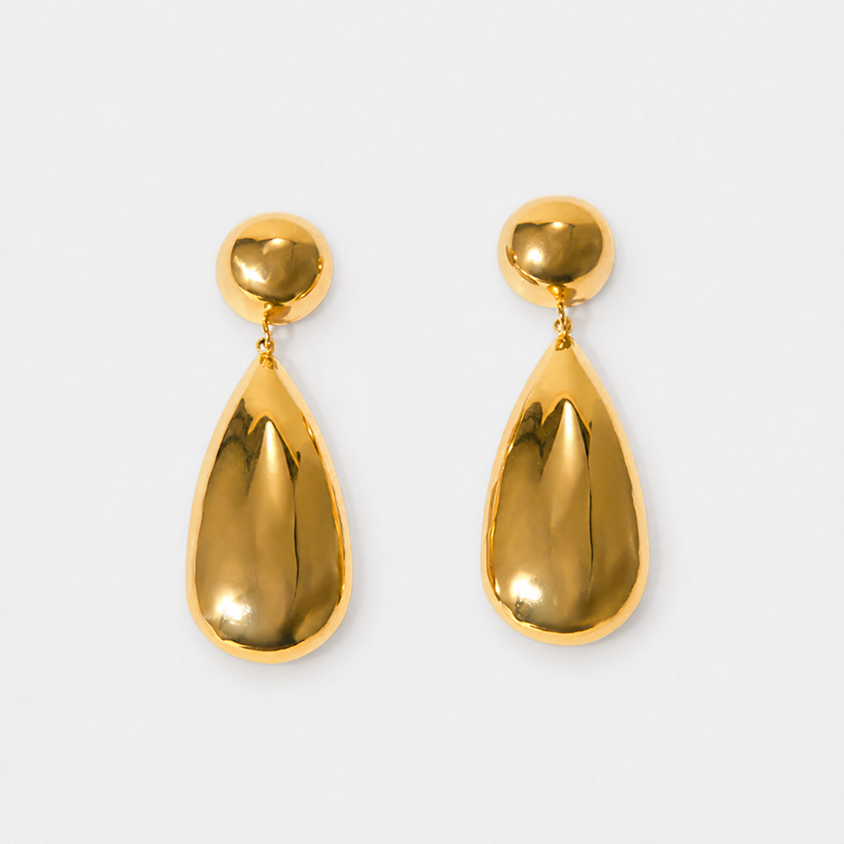 Goccia gold-coloured earrings with rounded studs and polished teardrops photographed alone