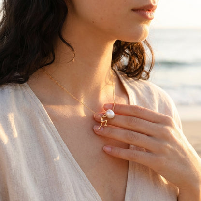 Close-up of gold pearl pendant detail