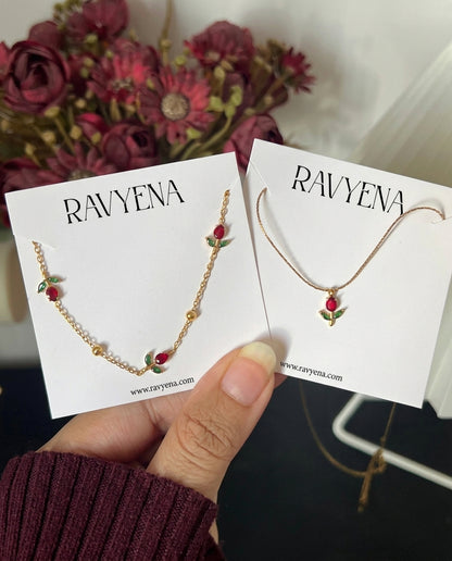 Dainty gold tulip necklace flat lay on neutral background