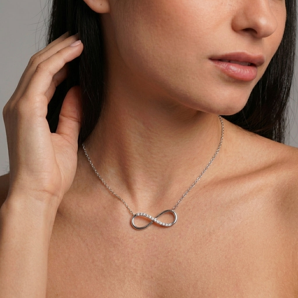 Infinite love necklace styled on a model's neckline