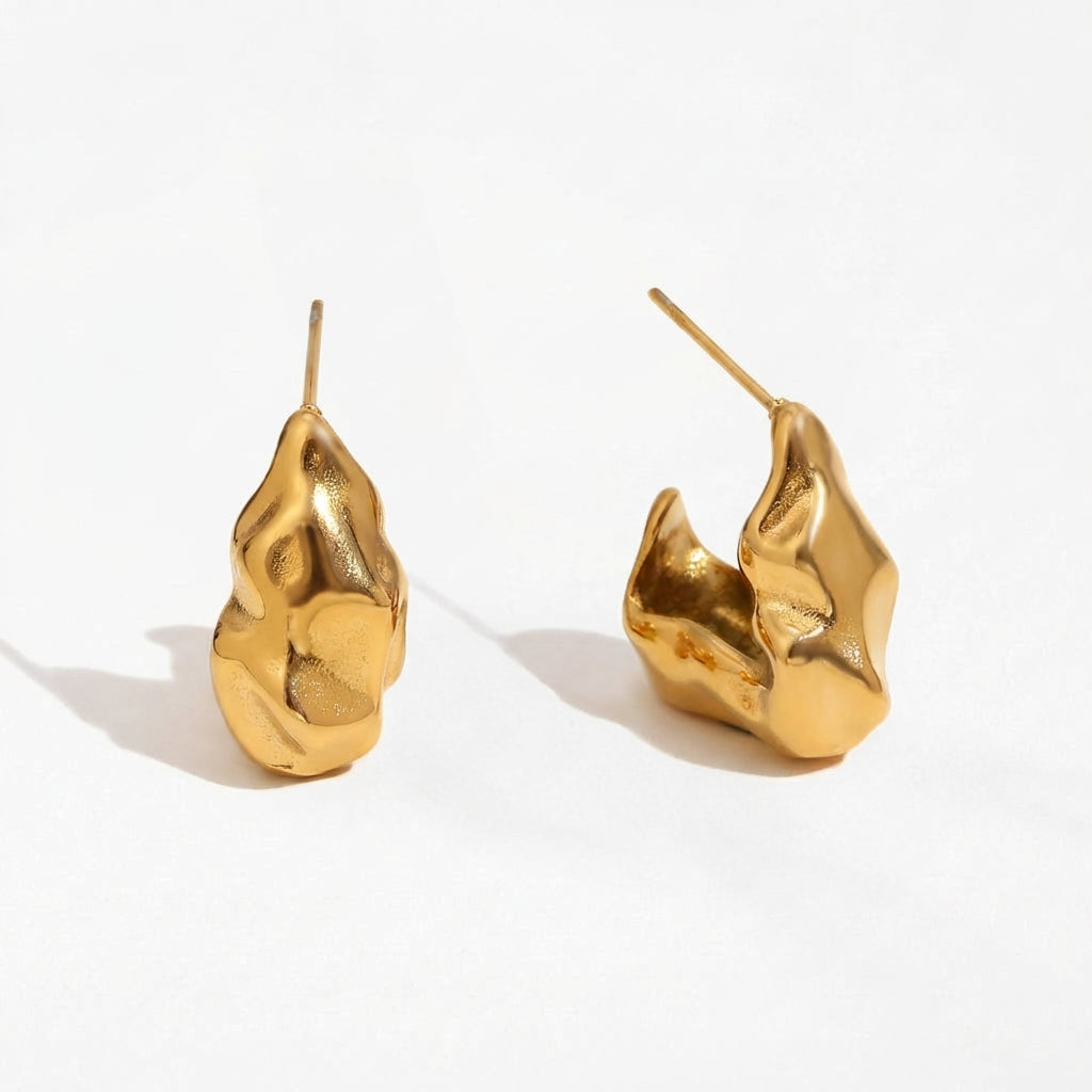 Molten Muse gold drop earrings with fluid sculptural form by Ravyena
