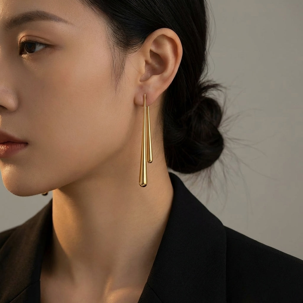 Gold asymmetrical earrings – side view