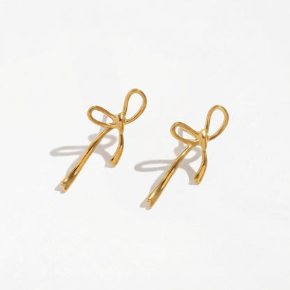 Wandering Bow gold drop earrings by Ravyena