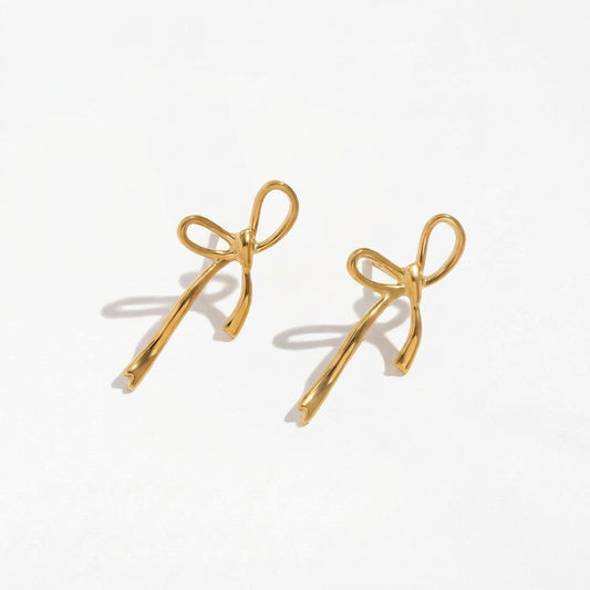 Wandering Bow gold drop earrings by Ravyena