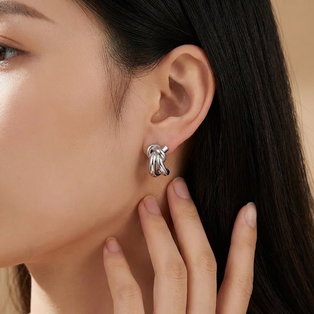 Sculptural knot huggie hoops, refined feminine design