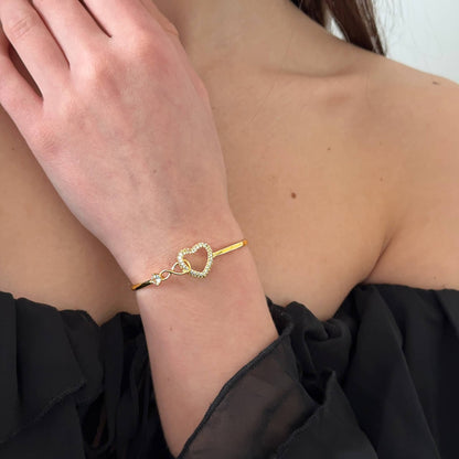 Infinity love bracelet styled with feminine outfit, romantic jewellery detail