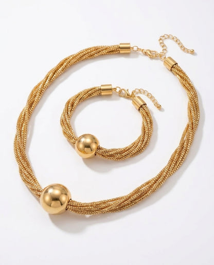 Polished ball pendant necklace in gold finish detail