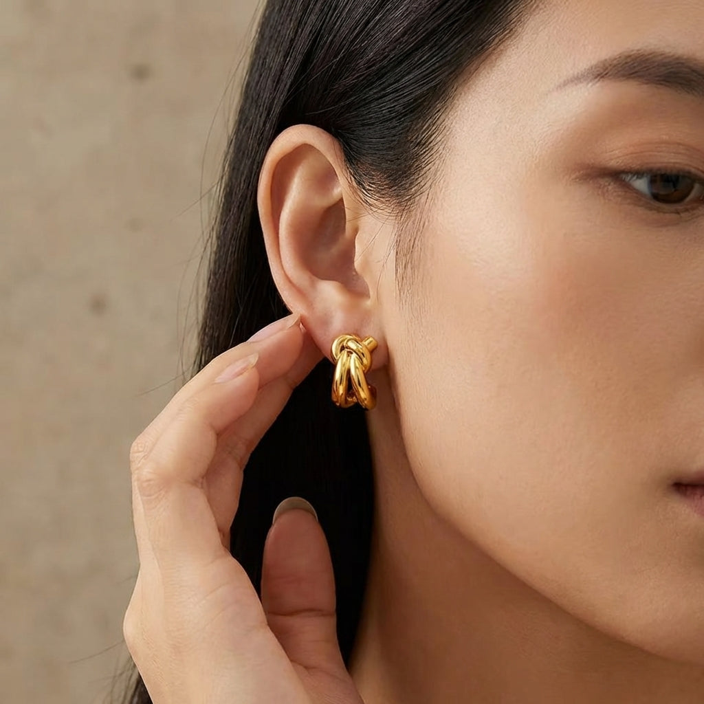 Gold knot huggie hoop earrings, sculptural design