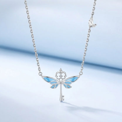 Close-up of silver flying keys pendant detail