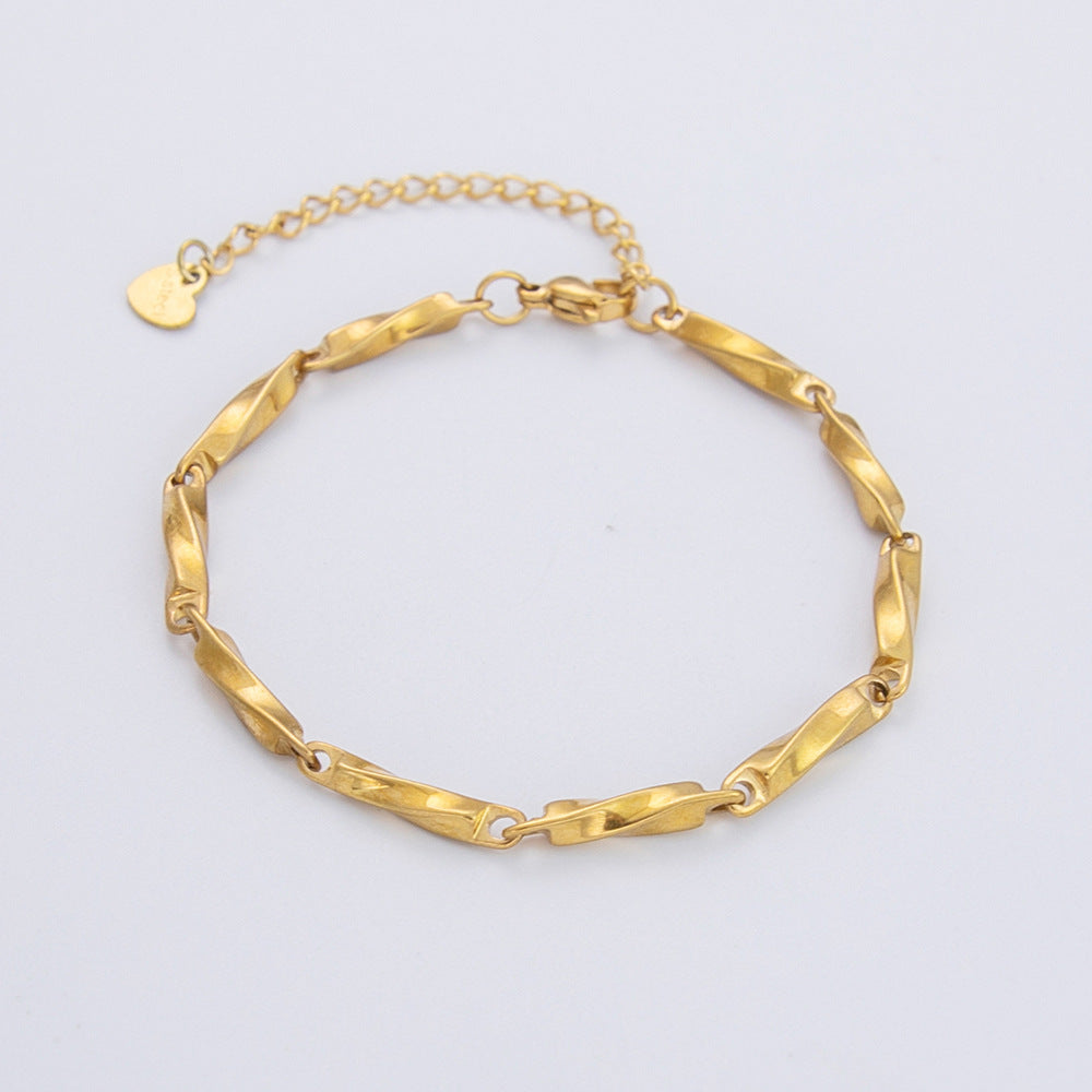 Minimal twist bracelet in polished gold finish