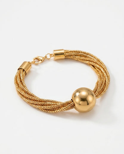 Multi-chain gold necklace with ball pendant close-up