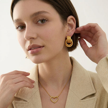 Giro Bella knot earrings worn on a model's ear