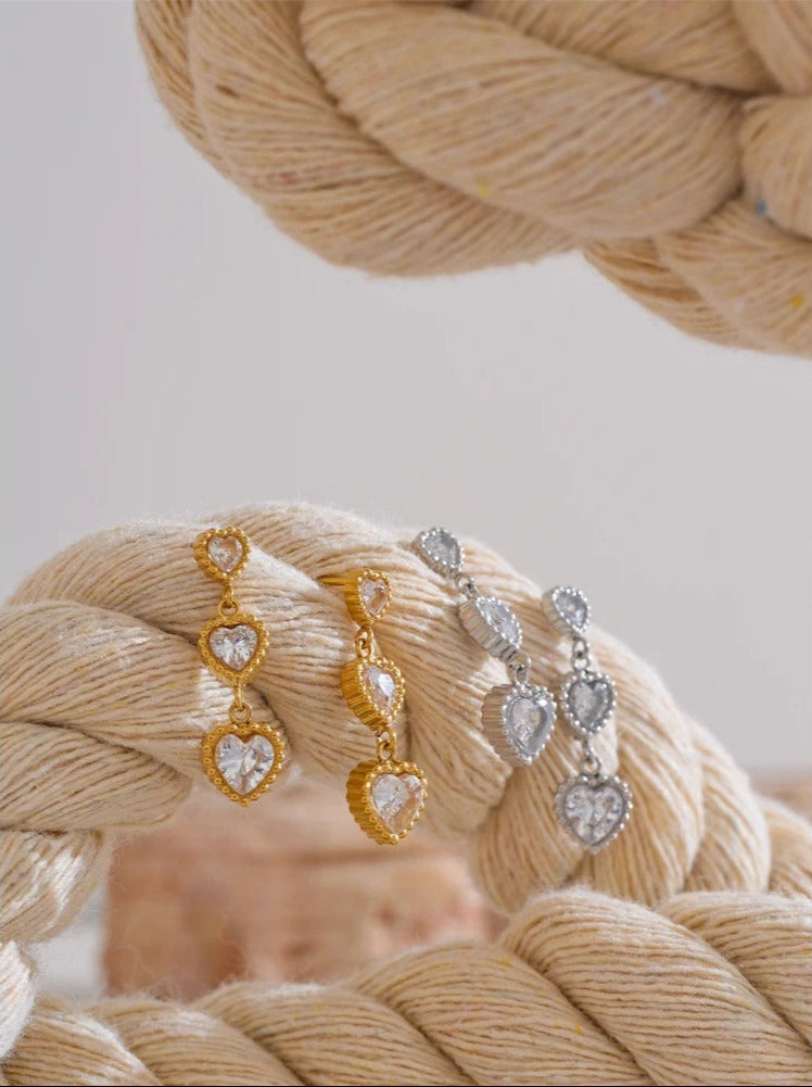 Trinity of hearts earrings detail shot, gold finish