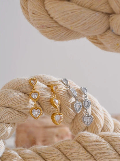 Trinity of hearts earrings detail shot, gold finish