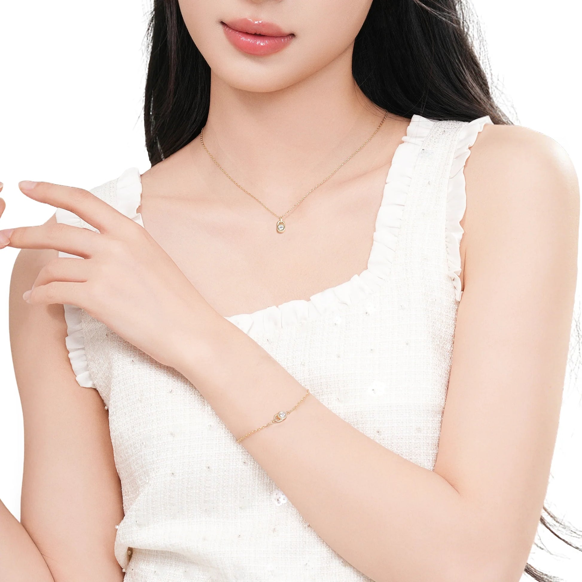 Sterling silver lock pendant bracelet styled on a model's wrist