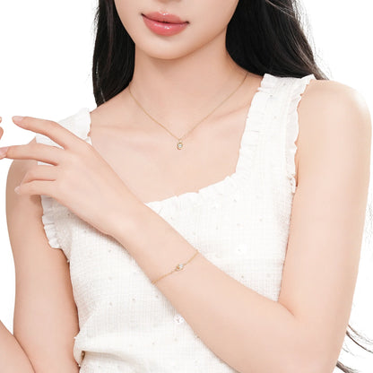 Sterling silver lock pendant bracelet styled on a model's wrist