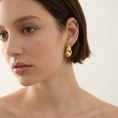 Ravyena Molten Muse earrings worn on model