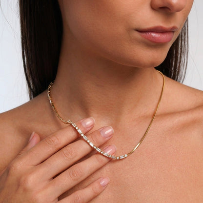 Gold crystal tennis necklace, side angle view