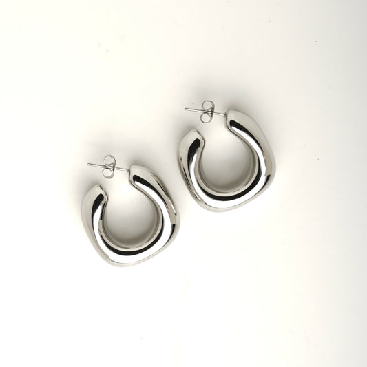 Chunky square studded gold earrings by Ravyena