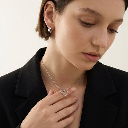 Heart pendant necklace, side angle view