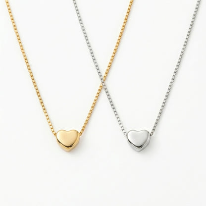 My petite heart necklace on neutral background