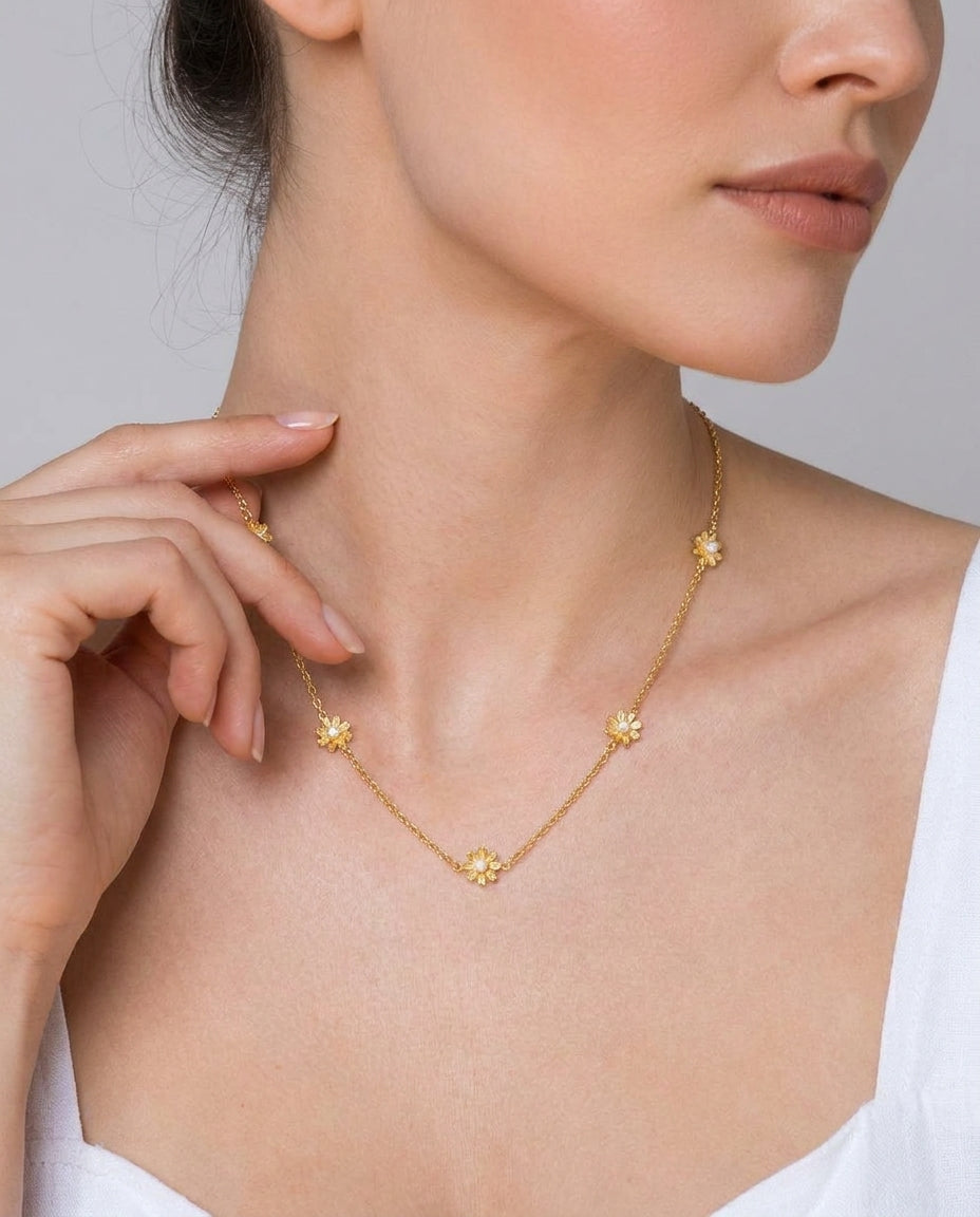 Waterproof gold flower choker necklace on neutral background