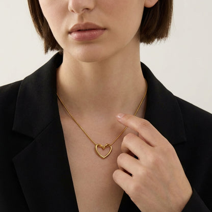 Solstice heart necklace styled on a model's neckline