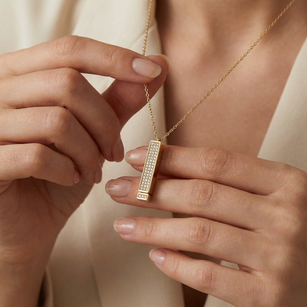 I love you necklace styled on a model's neckline
