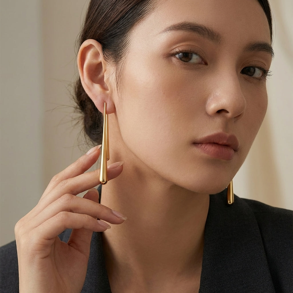 Water drop asymmetrical earrings – flat lay presentation