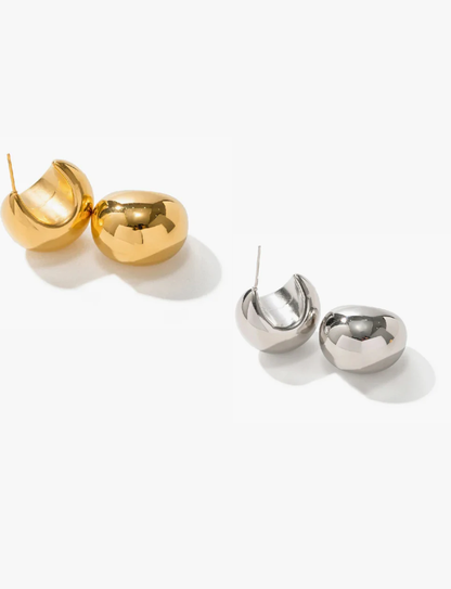 Crescent dome earrings on neutral background