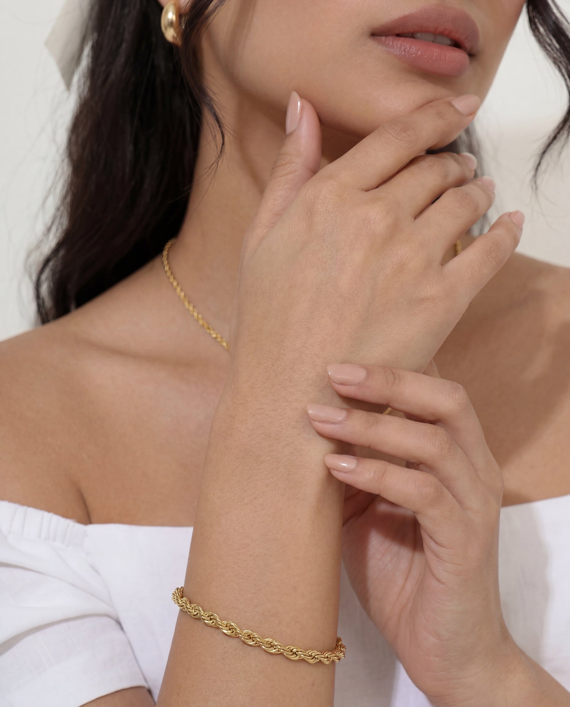 Polished gold rope chain bracelet with waterproof PVD finish, close-up