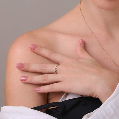 Gold wave-inspired ring, sculptural design
