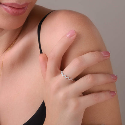 Highs and lows ring styled on a feminine hand